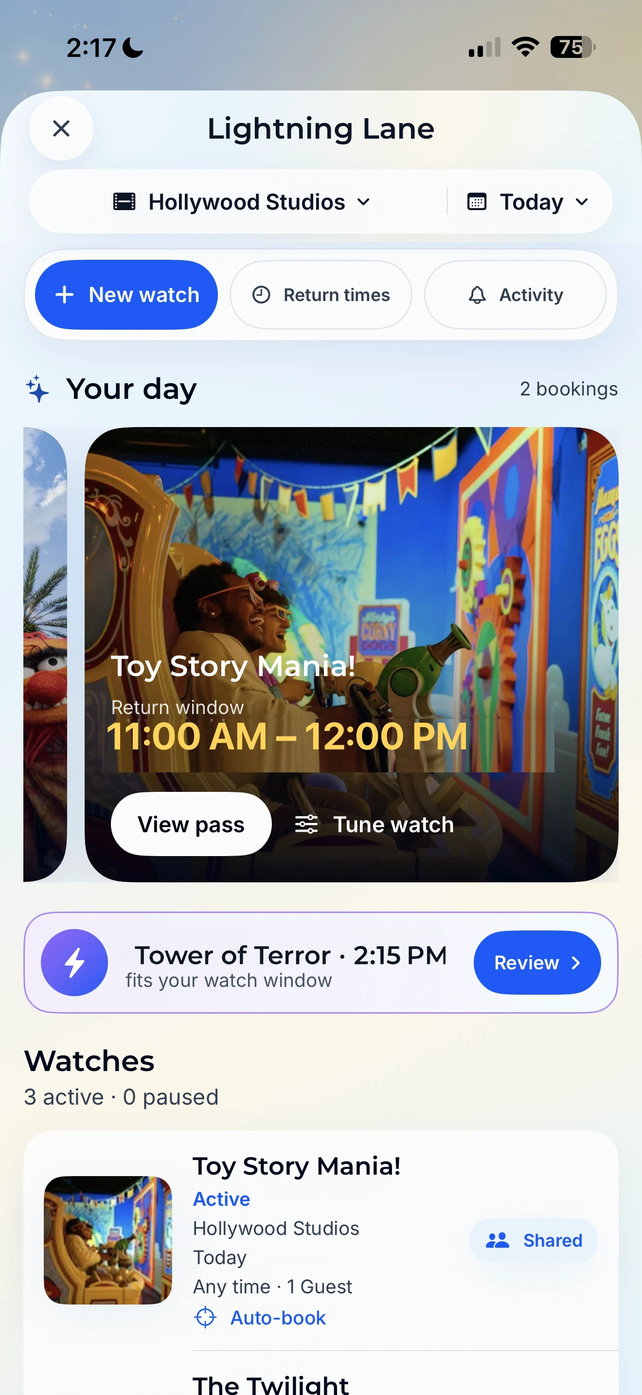 Lightning Lane showing Toy Story Mania booked from 11:00 AM to 12:00 PM, plus a Tower of Terror opportunity at 2:15 PM, with attraction photography, active watches, and return times.